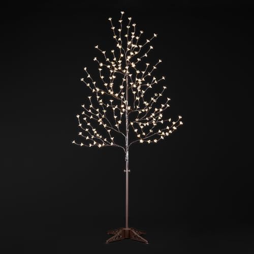 LIGHTSHARE 6.5 ft LED Cherry Blossom Tree glowing in a cozy living room