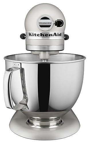 Close-up of the KitchenAid Artisan mixer head tilted back, showing the pouring shield