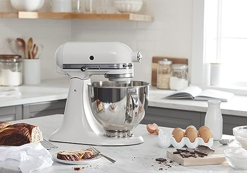 Person pouring batter into a bowl using the KitchenAid Artisan mixer