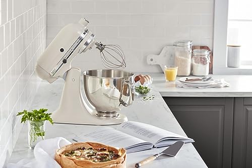 Box opened next to the KitchenAid Artisan mixer showing the pouring shield in place